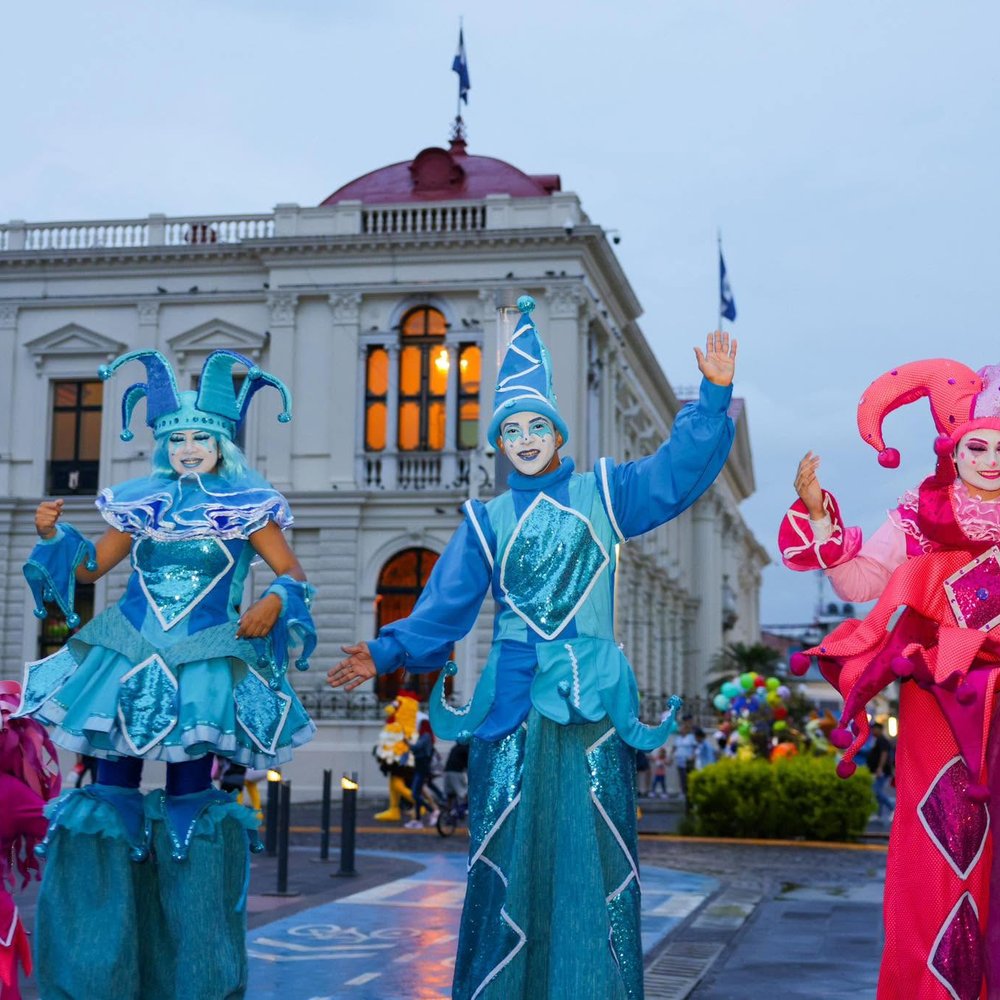 Stilt performers in a downtown San Salvador parade